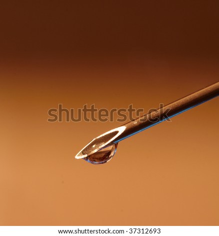 Droplet on the Point of Hypodermic Needle