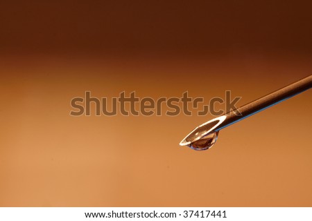 Droplet on the Point of Hypodermic Needle