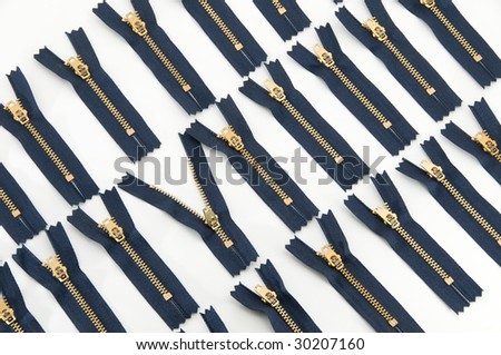 standout, be different, be open to new ideas: open zipper among rows of closed ones, isolated on white background