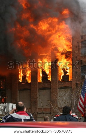 Watching a building in a raging fire