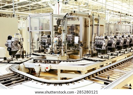 Production line for manufacturing of the engines in the car factory.