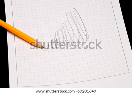 Pencil lay on the writing pad.