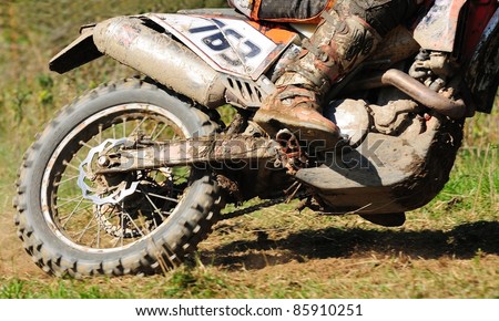 Detail view to the wheel of motocross bike.