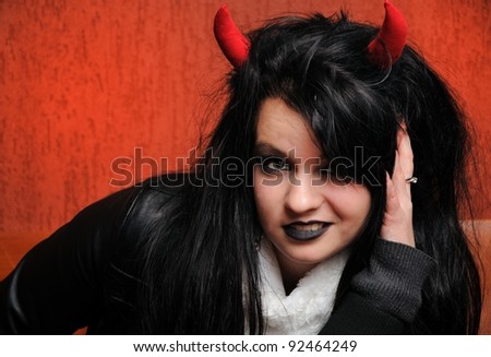Portrait of young devil girl.