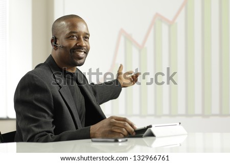African American business man presenting profits