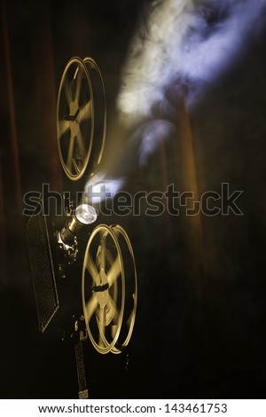 Film projector in smokey room.