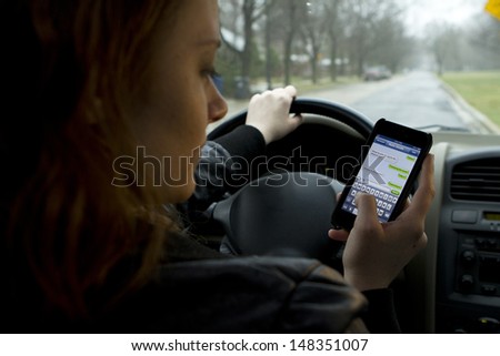 Young Girl Texting And Driving, Horizontal