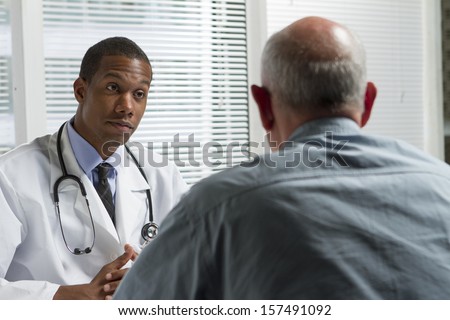 African American doctor consulting with patient, horizontal