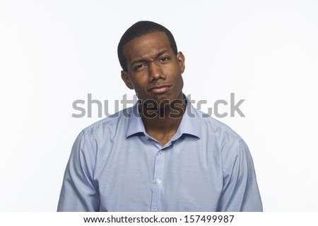 Young black man reacting with weird facial expression, horizontal