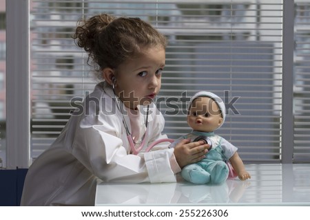 female child playing doctor