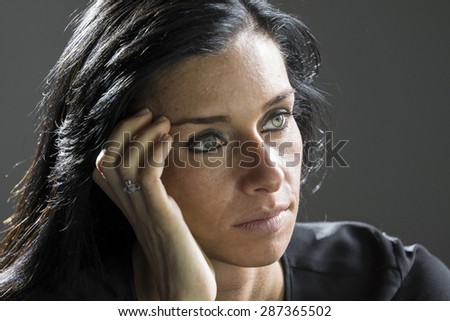 Portrait of a woman looking uncertain, troubled