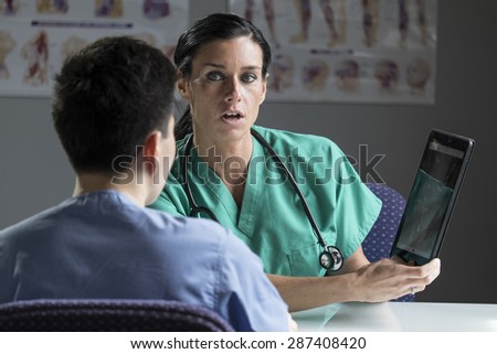 Female doctor consulting with patient in a medical setting