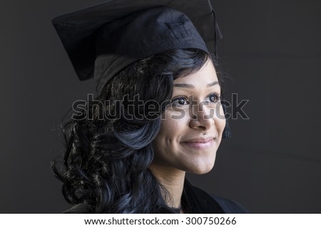 Graduation portrait of a young african american woman in her cap and gown, close up