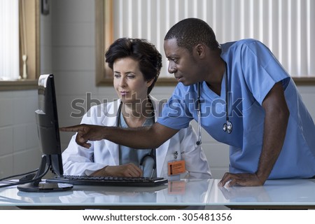 Caucasian female doctor and African American male nurse
