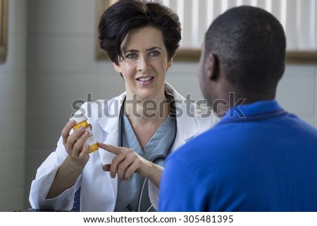 Caucasian female doctor and African American male patient