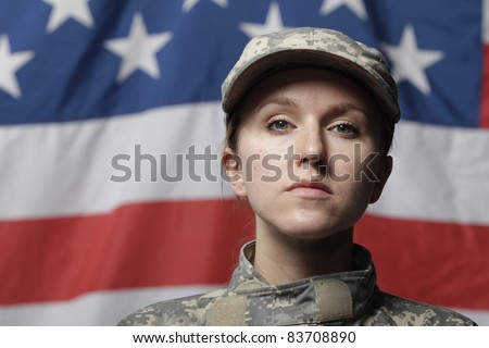 Female soldier in front of US flag