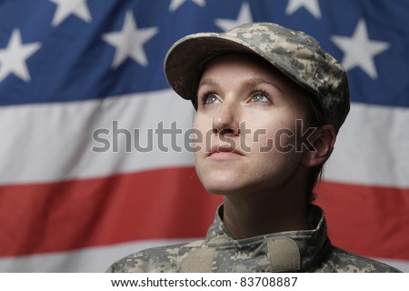 Female soldier in front of US flag