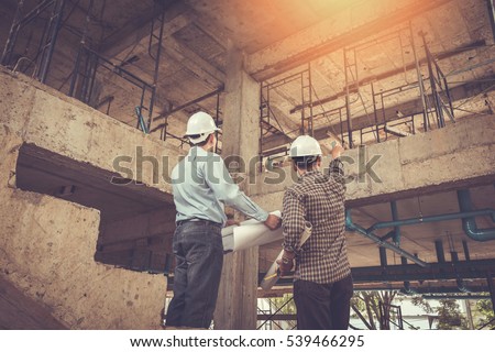 Architects, In construction site engineer, image effect Vintage tone, sun flare