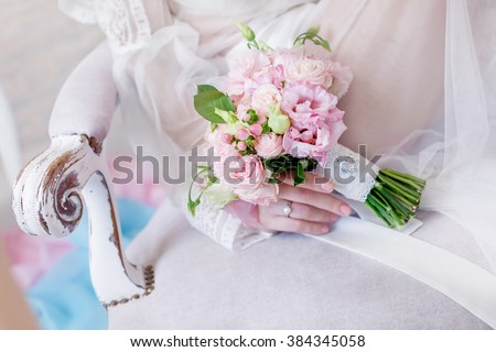 bouquet in the hands of the bride. The bride with a wedding bouquet. The bridal bouquet. wedding bouquet at bride\'s hands