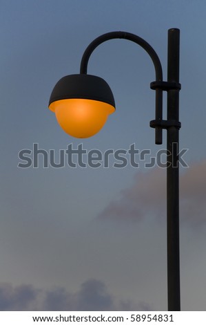 Lonely street lantern on dark sky background