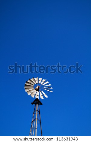 Windmill with blue sky plenty of room for text