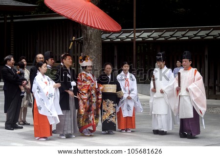TOKYO, JAPAN - JUNE 20: Shinto wedding takes place at Meiji Shrine at June 20, 2012 in Tokyo, Japan. Most of the Japanese have Shinto wedding and Buddhist funeral to respect both religion.