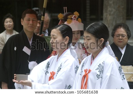 TOKYO, JAPAN - JUNE 20: Shinto wedding takes place at Meiji Shrine at June 20, 2012 in Tokyo, Japan. Most of the Japanese have Shinto wedding and Buddhist funeral to respect both religion.