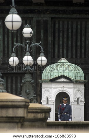 TOKYO, JAPAN - JUNE 19: Guard at the Imperial Palace June 19, 2012 ,Tokyo, Japan. This palace is the home of Emperor Akihito and Empress Michiko. The royal couple is very popular in Japan.