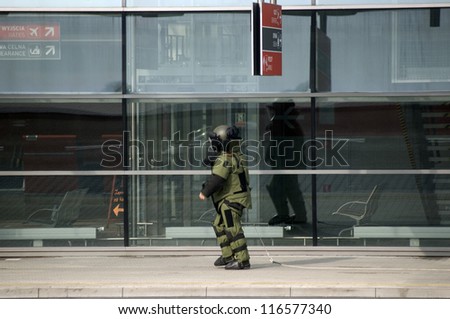 MODLIN AIRPORT, POLAND - OCTOBER 3: Anti-terrorist squad, police and fire brigade inspect the airport after a bomb alarm made by telephone by an unknown person at October 3, 2012, Modlin, Poland.
