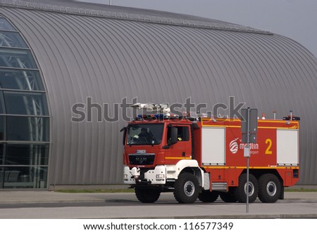 MODLIN AIRPORT, POLAND - OCTOBER 3: Anti-terrorist squad, police and fire brigade inspect the airport after a bomb alarm made by telephone by an unknown person at October 3, 2012, Modlin, Poland.