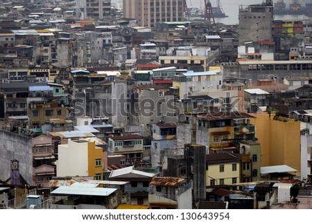MACAO - FEBRUARY 28: Apartments on February 28, 2013 in Macao. Macao is developing fast, but still the majority of the people live in harsh conditions. Poor quarters are around the town.