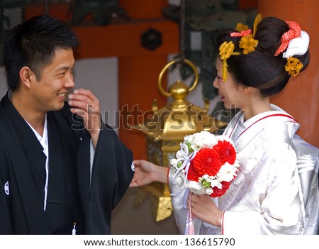 NARA, JAPAN - APRIL 5: Shinto wedding takes place at Kasuga Taisha shrine at April 5, 2013 in Nara, Japan. Most of the Japanese have Shinto wedding and Buddhist funeral to respect both religion.