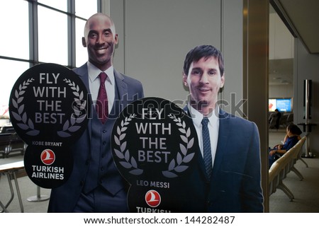 NARITA, JAPAN - JULY 19: Kobe Bryant and Leo Messi on July 19, 2013,Narita, Japan. The sport star on the Turkish Airlines advertisement at Narita Airport. TA was the best airline in Europe in 2012.