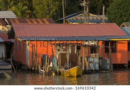 SARAWAK, MALAYSIA - JANUARY 2: Fishing village in the Bornean jungle on January 2, 2014, Sarawak, Malaysia. Local Malays live in remote villages and try to survive on fishing and trading.