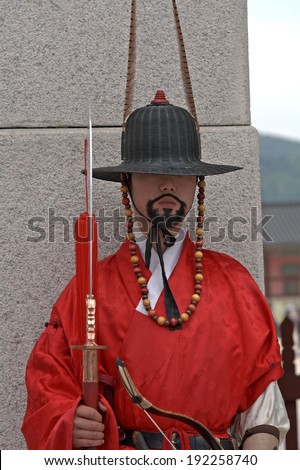 SEOUL, SOUTH KOREA - MAY 11: Royal guard on May 11, 2014, Seoul, South Korea. Guards in medieval clothes had been protected the Gyeongbok Palace for centuries. This palace is a world heritage site.