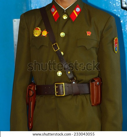 PANMUNJOM, NORTH KOREA - JUNE 13: North-korean soldier in the MAC Building on June 13, 2014 in Panmunjom, North Korea. The armistice agreement was signed in 1953 which divided Korea in two parts.