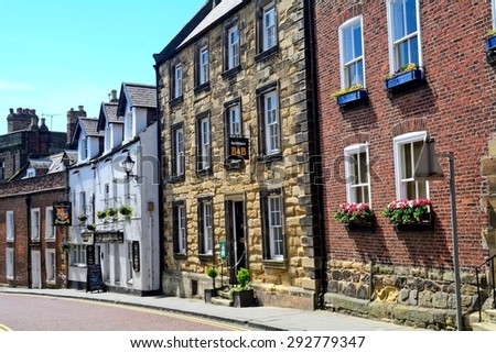 ALNWICK, ENGLAND - JUNE 11: Old town on June 11, 2015 at Alnwick, England. Alnwick in Northumberland has a lovely medieval old town.