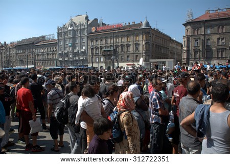 BUDAPEST - SEPTEMBER 1 : War refugees at the Keleti Railway Station on 1 September 2015 in Budapest, Hungary. Refugees are arriving constantly to Hungary on the way to Germany.