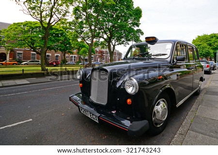 TYNEMOUTH - 15 JUNE : Taxi at 15 June 2015 in Tynemouth, England. Taxis in England are mainly old-fashioned cars.