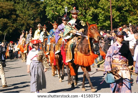 TOKYO, JAPAN - NOVEMBER 3: Traditional Japanese horsemen ride on horses during a festival of the birthday of Emperor Meiji, November 3, 2009 in Tokyo, Japan.