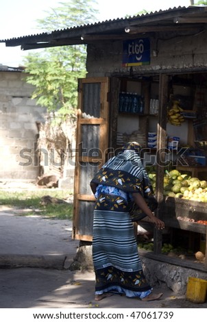 NUNGWI, ZANZIBAR - JANUARY 2: Local woman sells local produce in the village, January 2, 2010 in Nungwi, Zanzibar.
