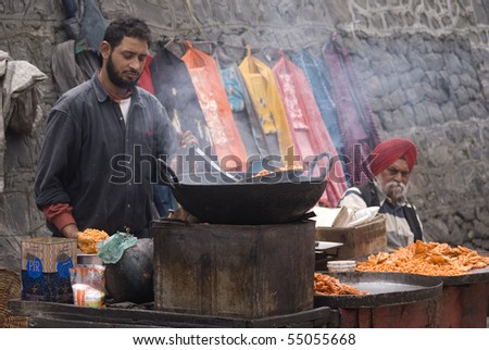SRINAGAR, INDIA - APRIL 29: Local man selling food in the morning market, April 29, 2010 in Srinagar, Kashmir, India