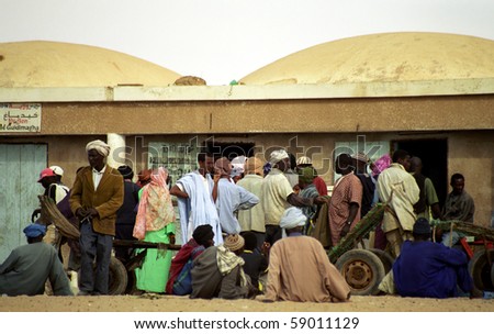 NOUAKCHOTT, MAURITANIA - JAN 5: Local people sell fish at the beach at January 5, 2006 in Nouakchott, Mauritania. Fresh fish is sold daily on the beach.