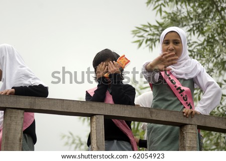 SRINAGAR, INDIA - APRIL 29: Kashmirian kids go to school April 29, 2010 in Srinagarar, Kashmir, India. In Kashmir children go to Islamic schools, so girls wear scarves.