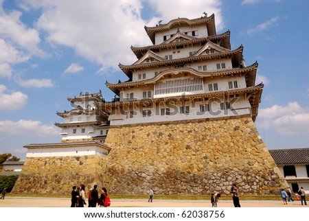 HIMEJI, JAPAN - MARCH 26: Tourists visit the castle, March 26, 2008 in Himeji, Japan. Himeji castle is one of the few castles in Japan not destroyed in the war. It is a UNESCO World Heritage site.