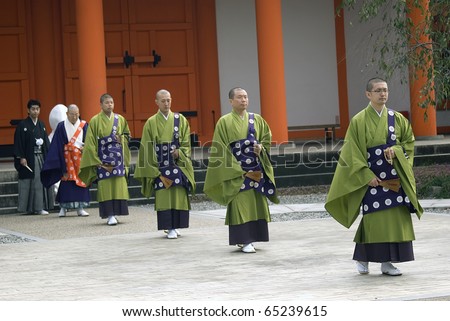 KYOTO, JAPAN - OCTOBER 29: Shinto wedding takes place at Ryoan Temple at October 29, 2010 in Kyoto, Japan. Most of the Japanese have Shinto wedding and Buddhist funeral to respect both religion.