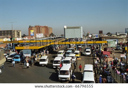 SOWETO, SOUTH AFRICA - JULY 18: Local bus station, July 18, 2005 at Soweto, South Africa. Transport in Africa is by local minibuses. You can get anywhere with these small vehicles.