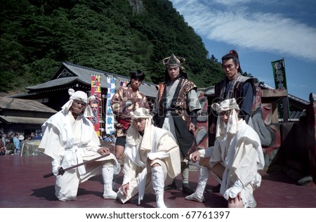 EDOMURA, JAPAN - OCTOBER 1: Ninjas after a performance at October 1, 1993 in Edomura, Japan. Edomura is Japan\'s most favorite theme park with ninjas and samurais. A big surprise for children.