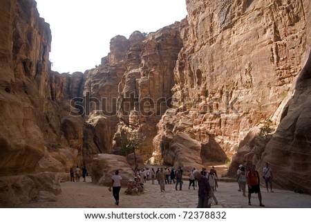 PETRA, JORDAN - OCTOBER 18: Visitors visit Petra on October 18, 2010 in Petra, Jordan. Petra is one of the world most famous sites and is listed as a World Heritage site by UNESCO.