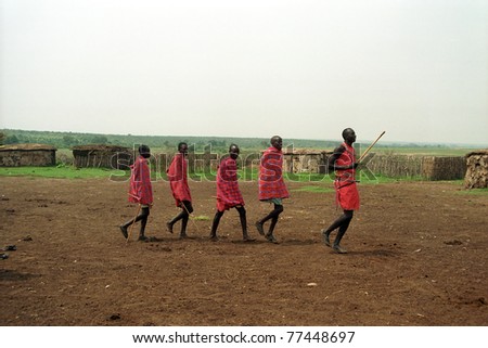 MAASAI MARA, KENYA - FEBRUARY 4: Maasai morani\'s numba dance, 4 February , 2004 at Masaai Mara, Kenya. The Maasai are the most famous tribe in Africa. They are nomadic and live in small villages.